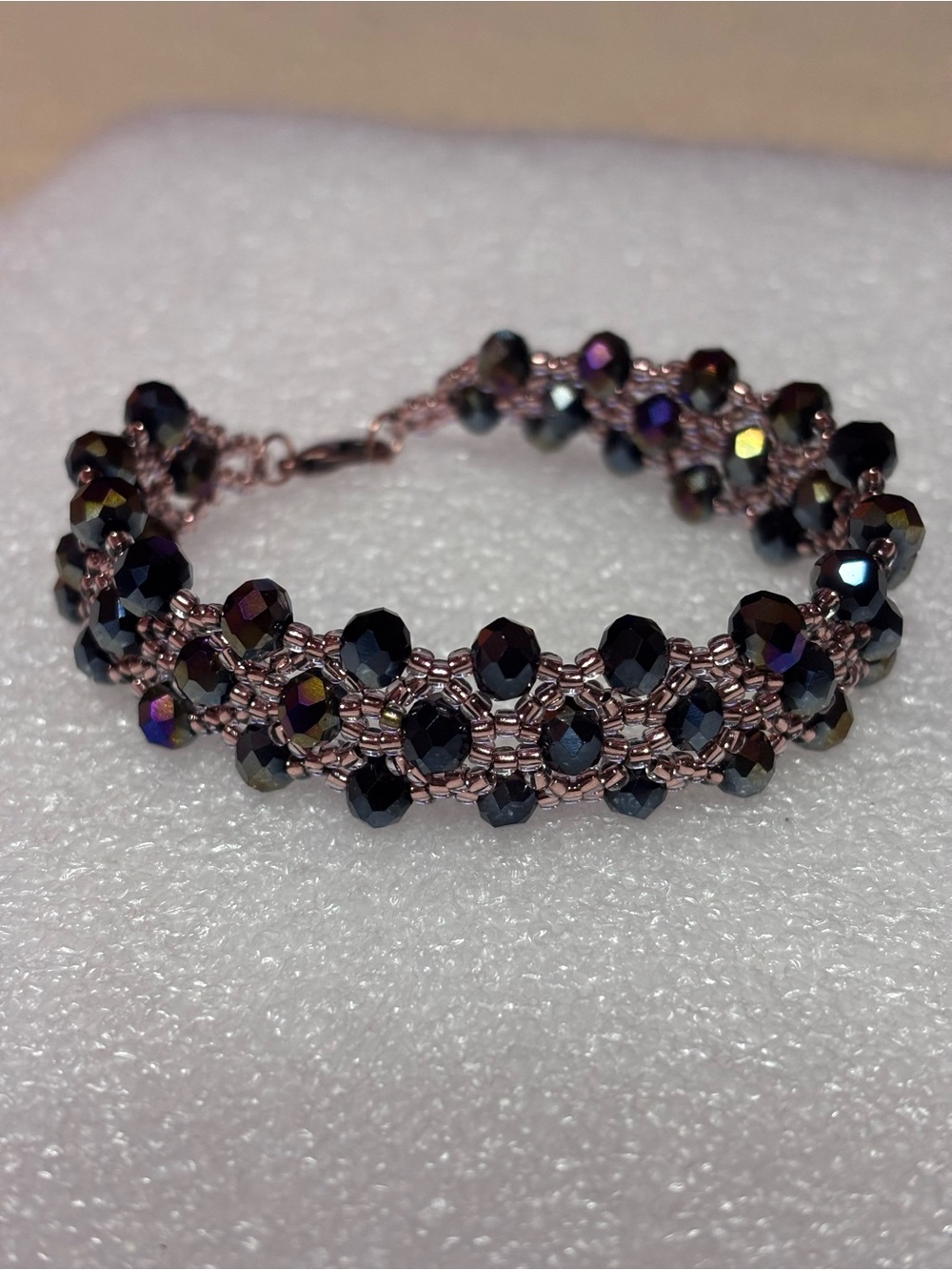 Iridescent Black Beaded Bracelet with Copper tone accents 7 inches
